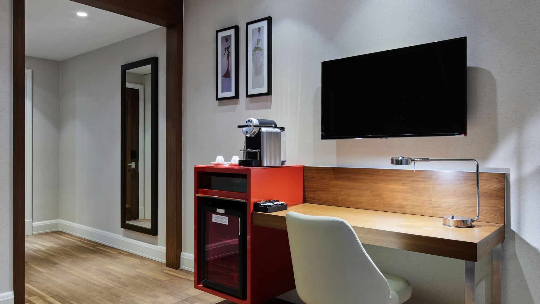 Workspace with Nespresso machine and TV in Titanic Duplex Suite at Titanic Gendarmenmarkt Berlin