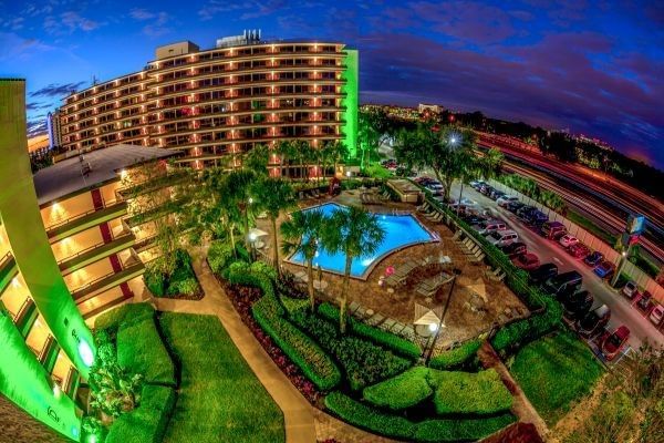 Exterior (dusk) courtyard and pool at Rosen Inn at Pointe Orlando