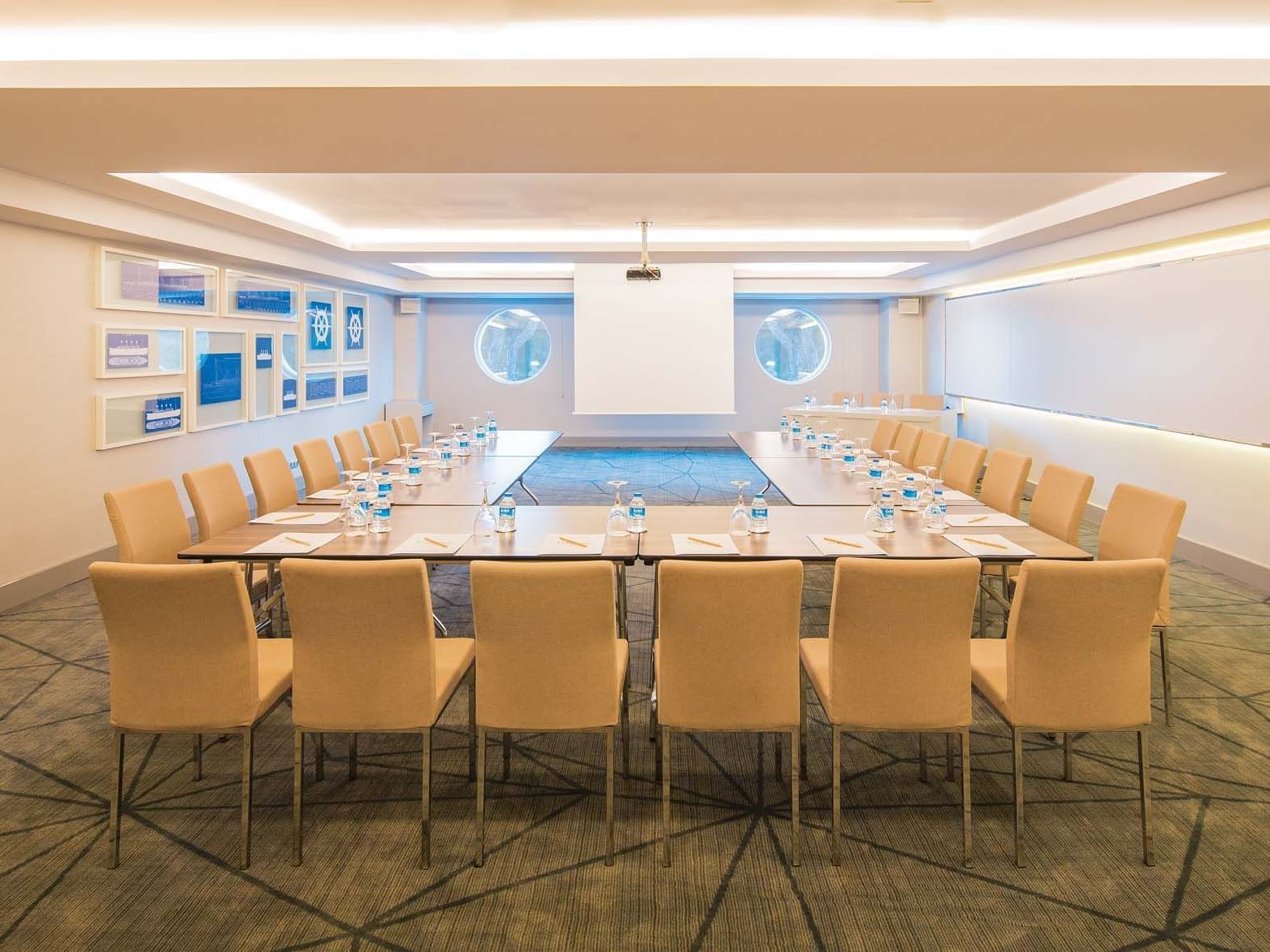 U-shaped table set-up with cozy chairs in Atlantic Meeting Hall at Titanic Deluxe Golf Belek