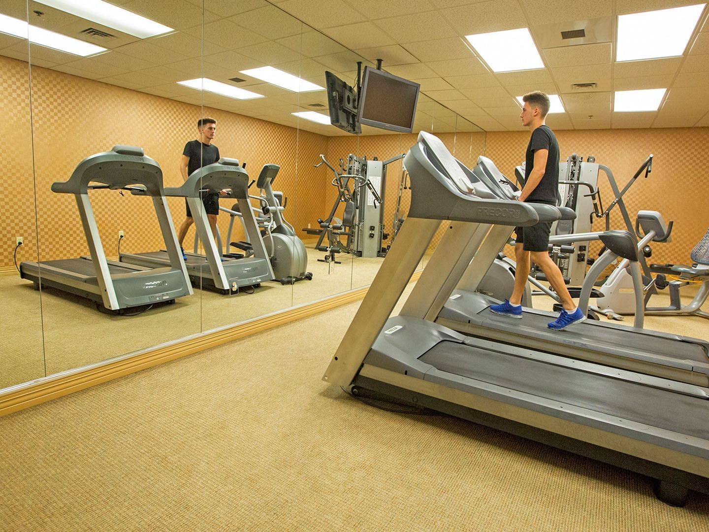 Man on a treadmill in the Fitness center at Music Road Resort