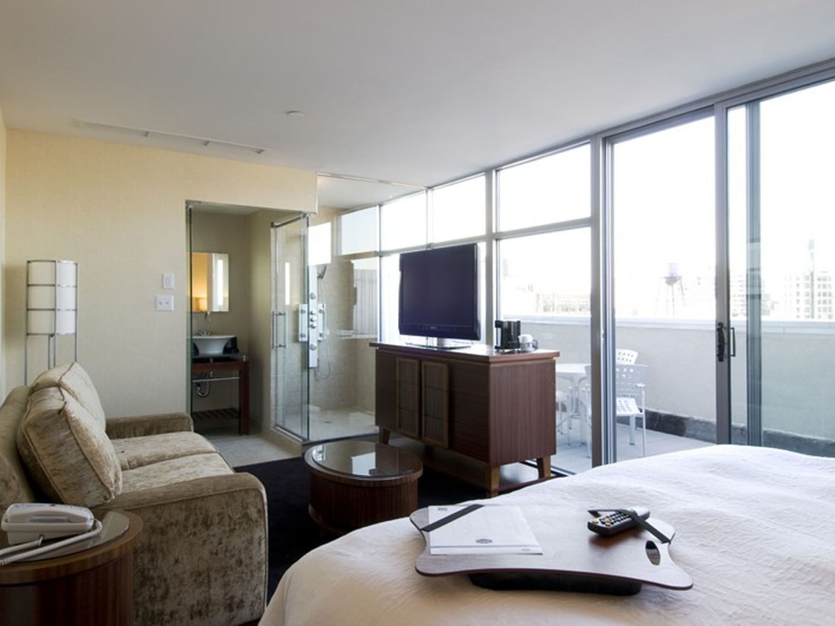 Spacious SoHo King City View room at Soho 54 Hotel in NYC, featuring open bathroom and balcony