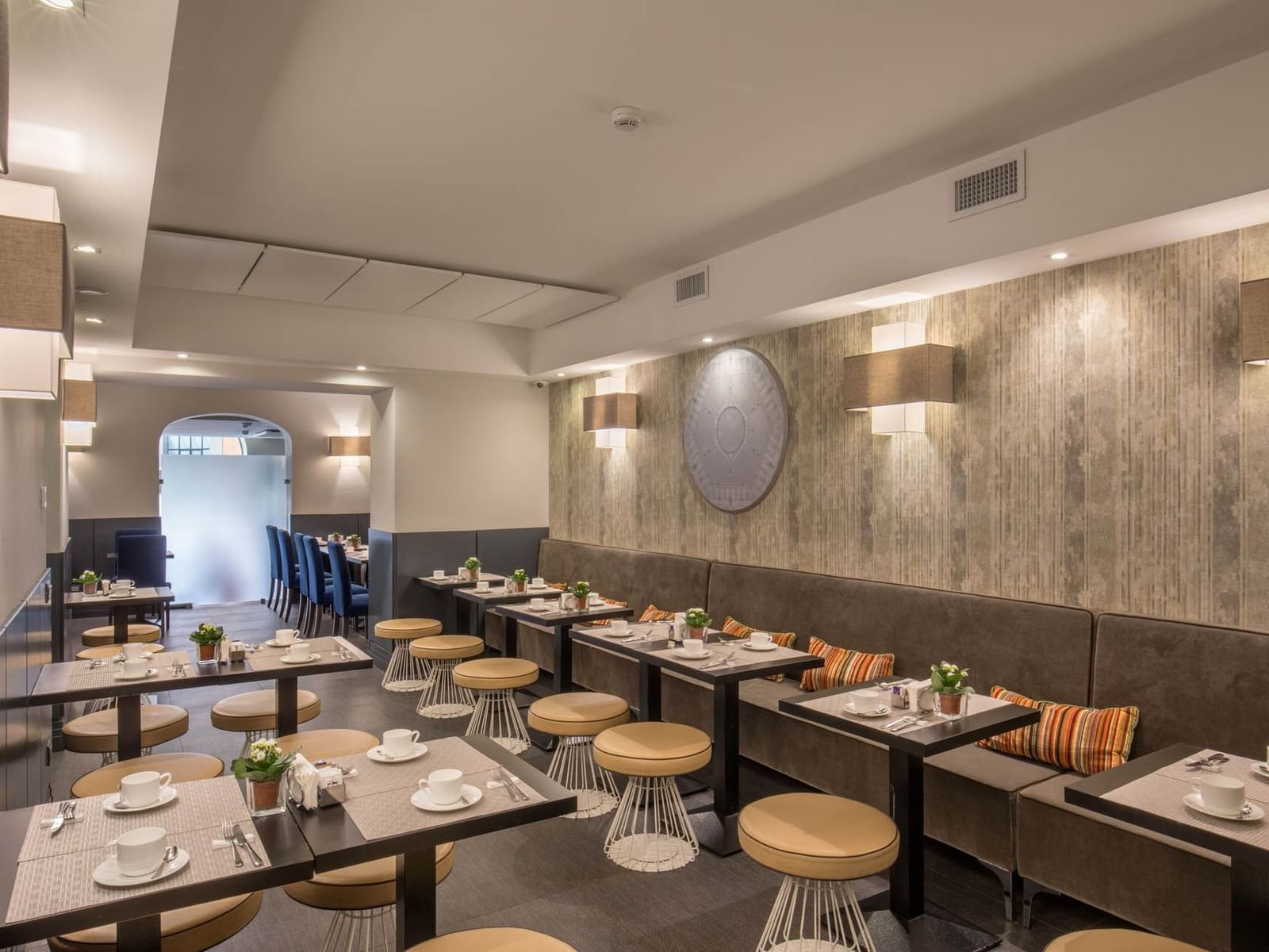 Modern restaurant interior with seating and decorative lighting, perfect for dining and relaxation at The Republic Hotel