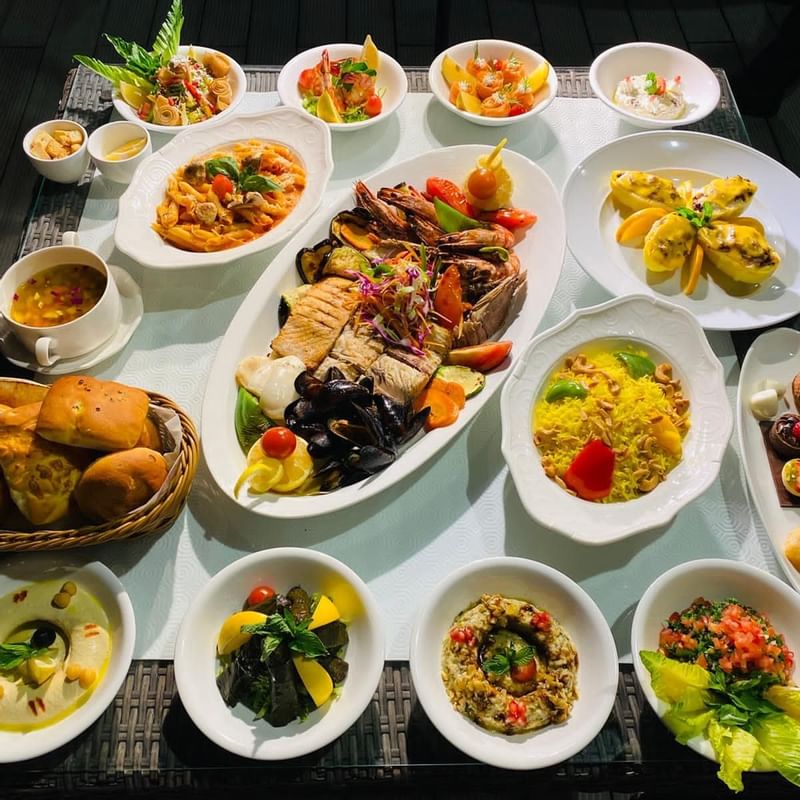 A variety food of dishes served on a table at Warwick Doha