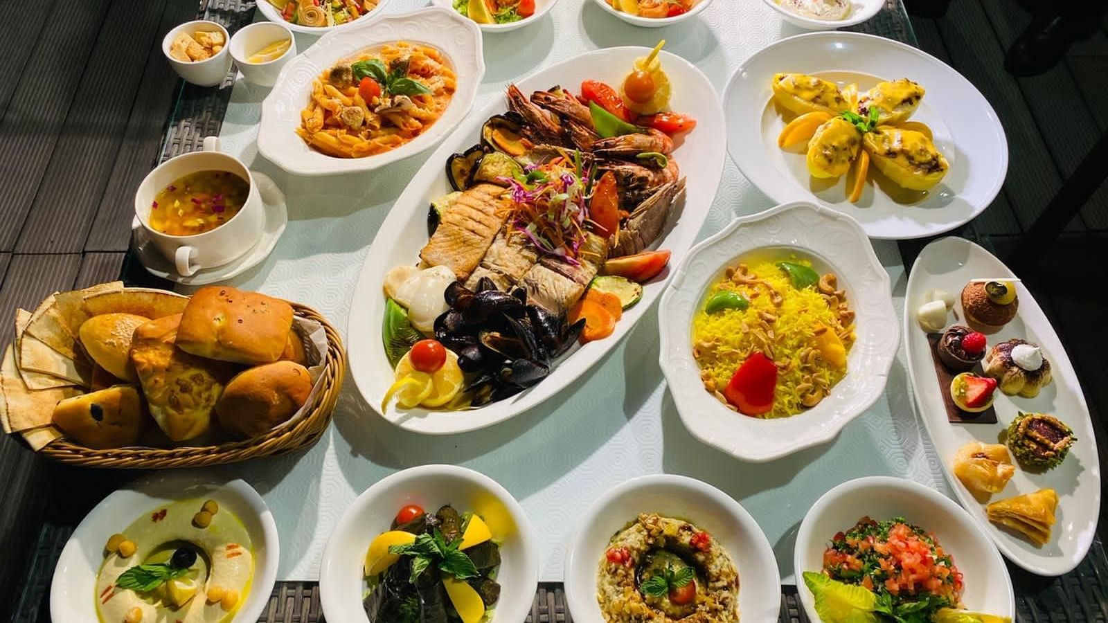 A variety food of dishes served on a table at Warwick Doha