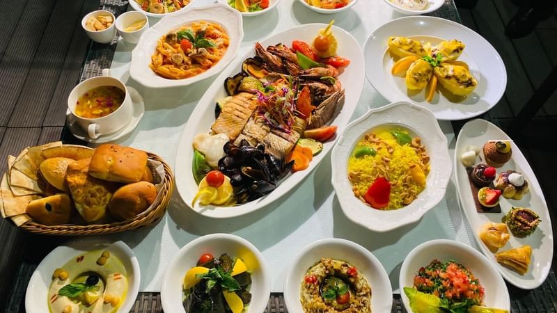 A variety food of dishes served on a table at Warwick Doha