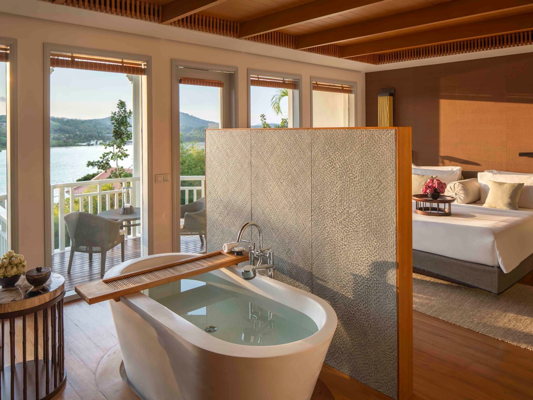 Bathtub & bedroom in Bay View Suite at Amatara Wellness Resort