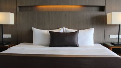 Close-up of a king bed in Deluxe Room at Amara Sanctuary Resort