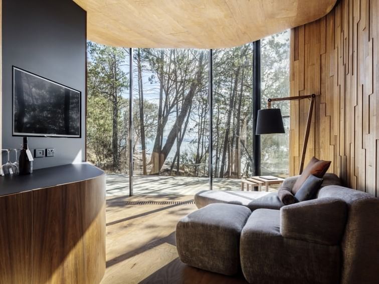 Living area with an outdoor view in Coastal Pavilion Bay at Freycinet Lodge