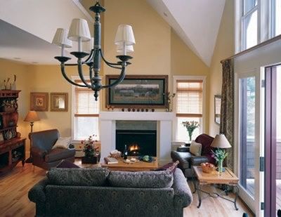 Inviting living area with a vaulted ceiling, cozy fireplace, and beautiful furnishings at Castle Hill Resort and Spa
