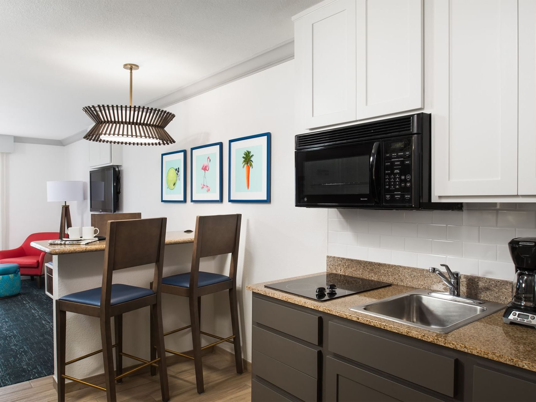 two chairs next to a kitchen area