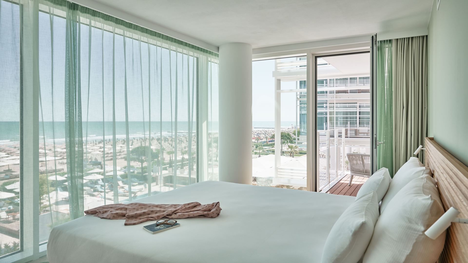 Bed in Bateo Suite Deluxe Sea view at Falkensteiner Hotels