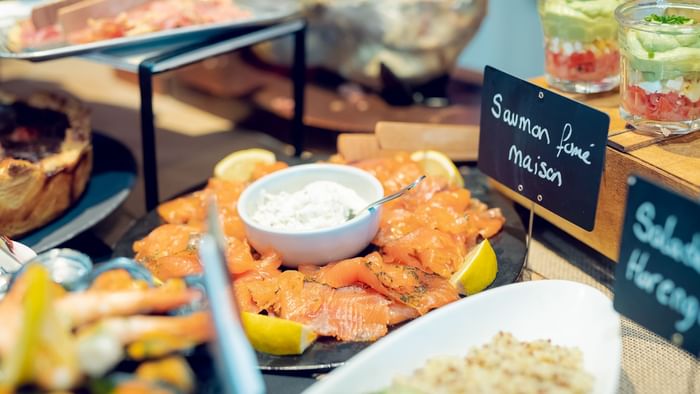 Salmon dish in the buffet in a restaurant at Originals Hotels