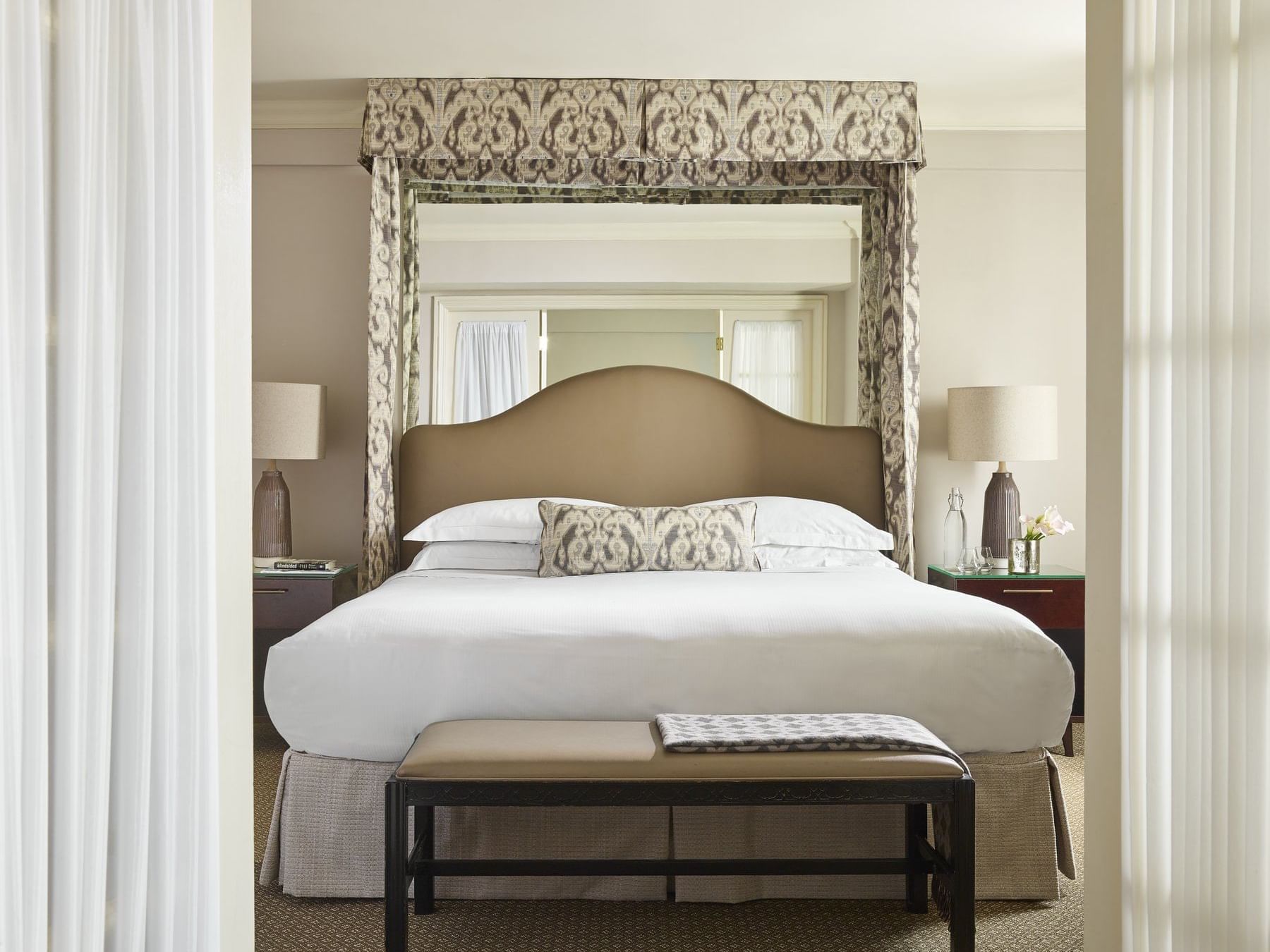 One-Bedroom Suite with a king bed & nightstands at Eliot Hotel