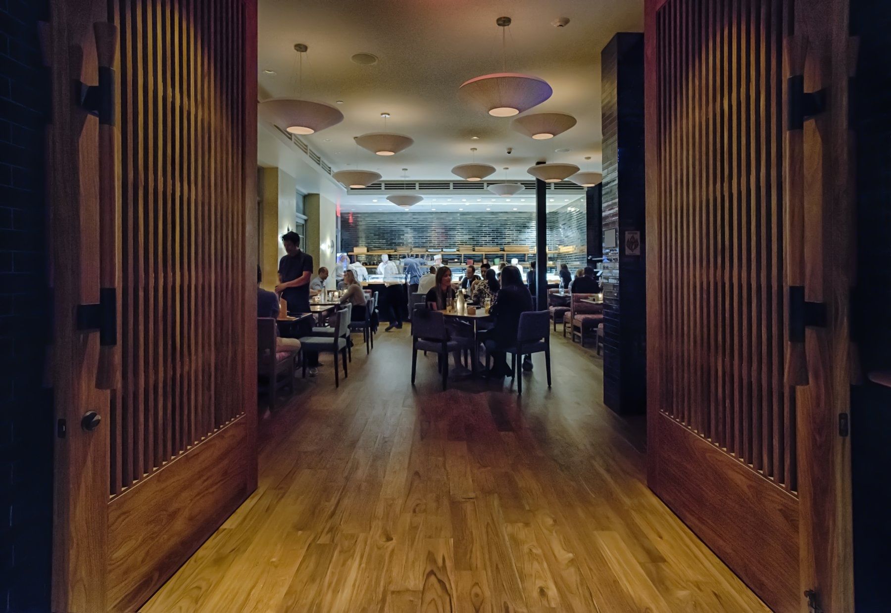 a dining area with people sitting at tables