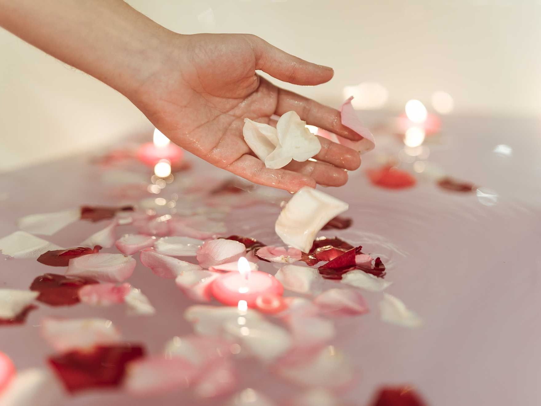 A lady add petals to bathtub at Artyzen Grand Lapa Hotel Macau