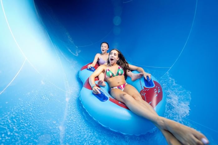 Two ladies water sliding at Island Waterpark at Showboat