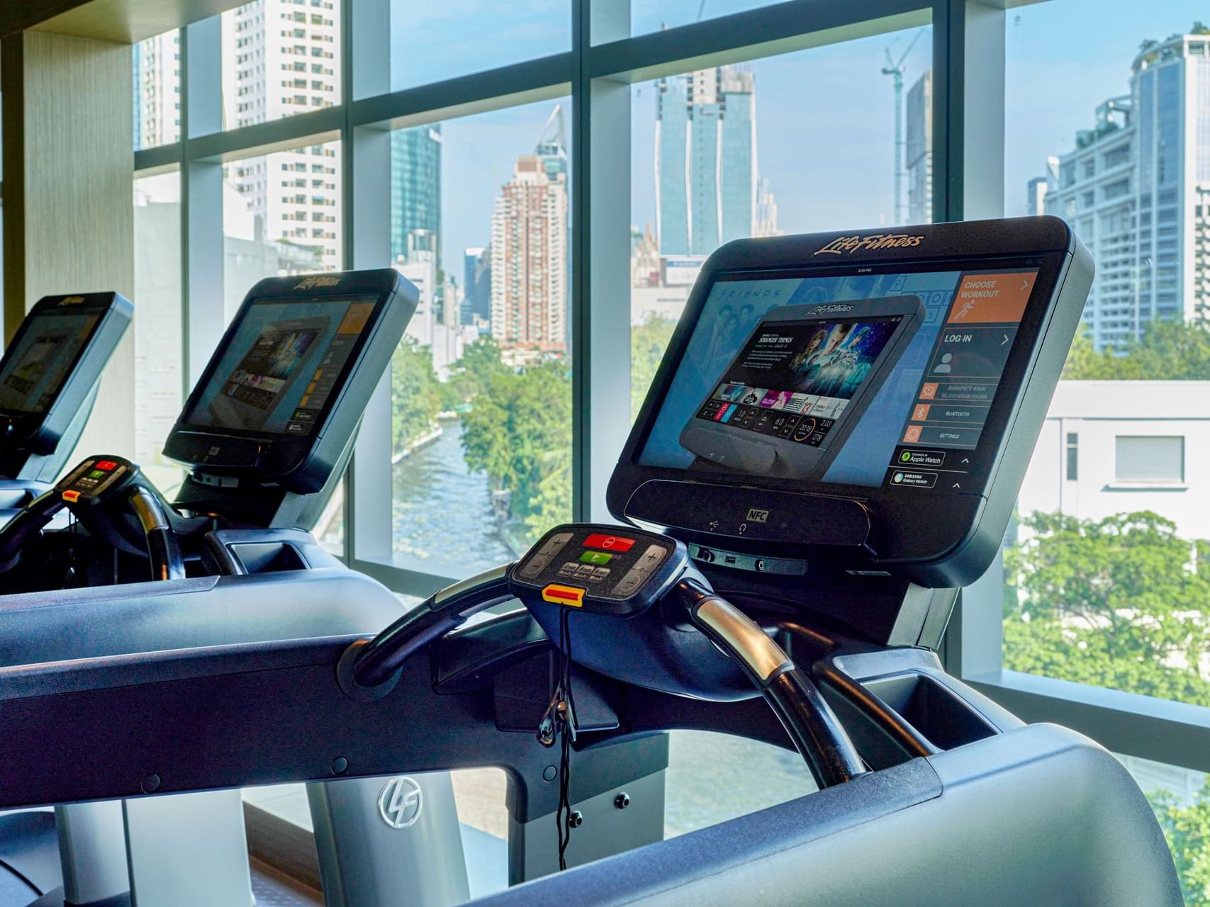 Treadmills in a Gym, city view at Chatrium Hotels & Residences