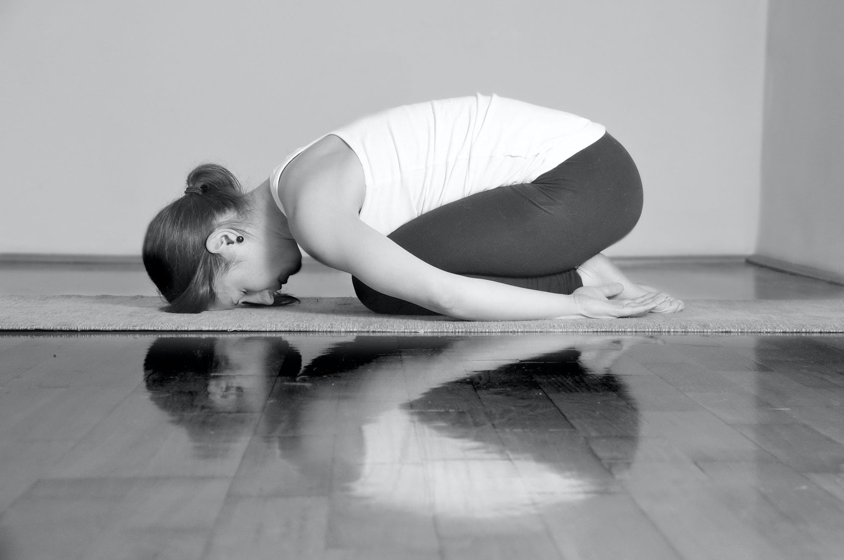 Lady doing Yoga on the mat at Domaine de Manville