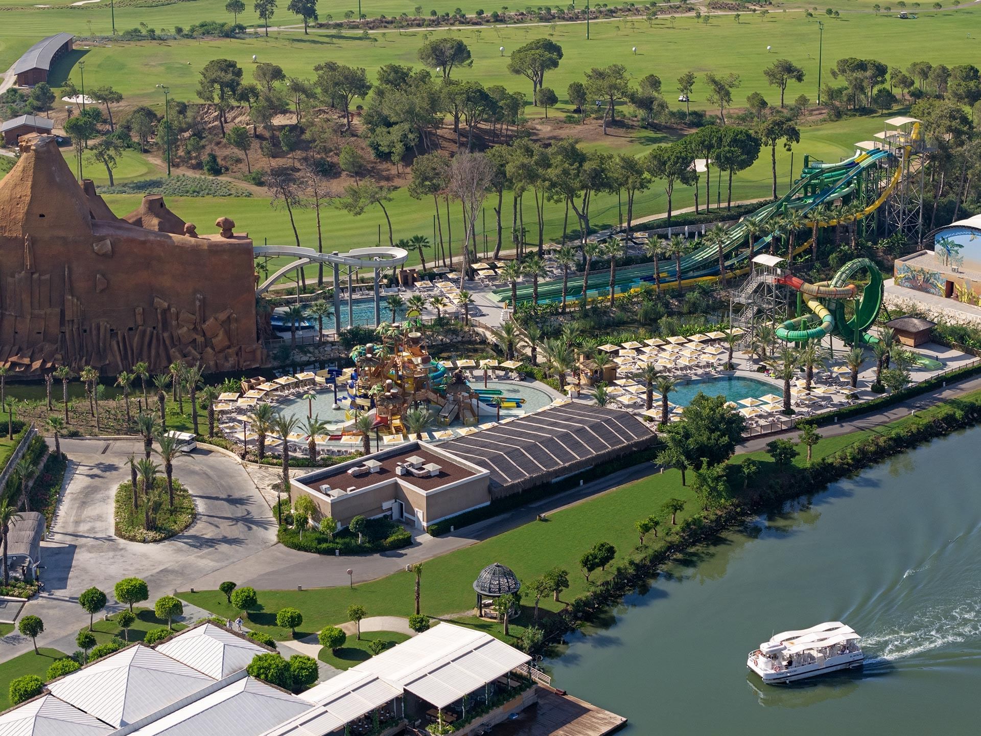 Aerial view of Aquapark, river, and the golf course at Titanic Deluxe Golf Belek