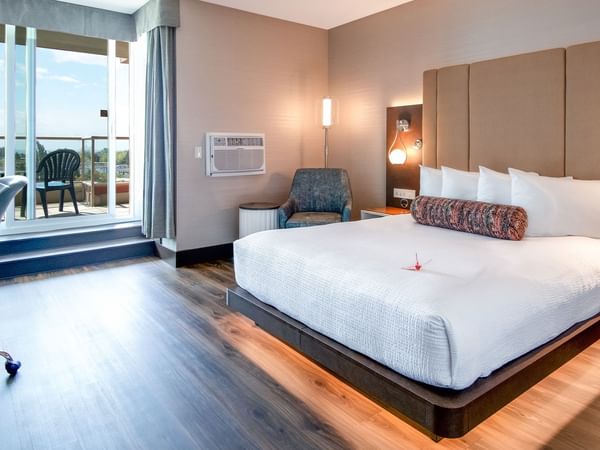 Bed with sofa chair and view