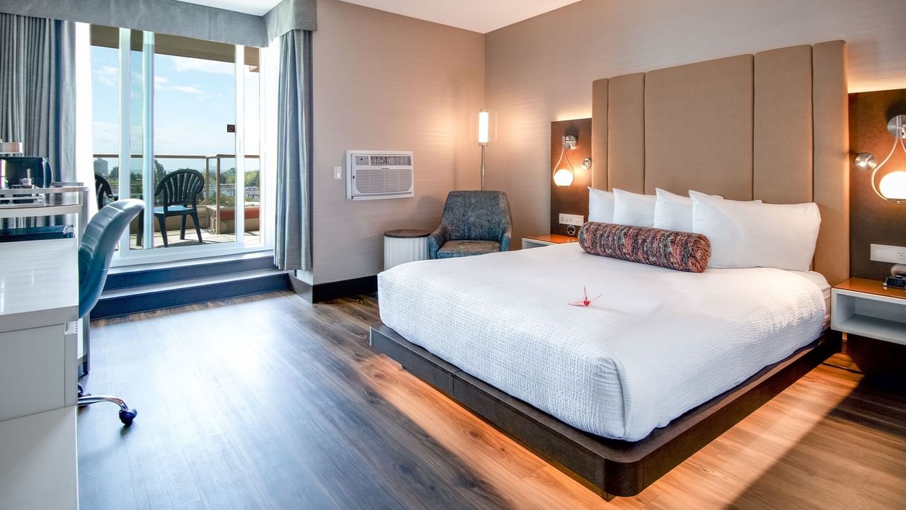 Bed with sofa chair and view