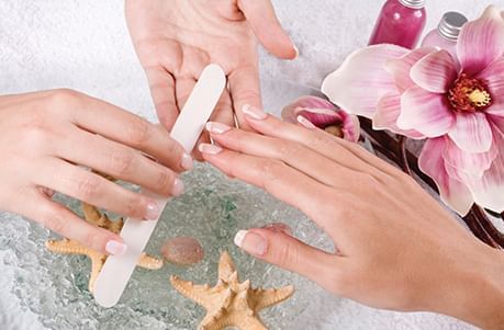 Woman having her nails filed at a salon at Lake Buena Vista Resort Village & Spa