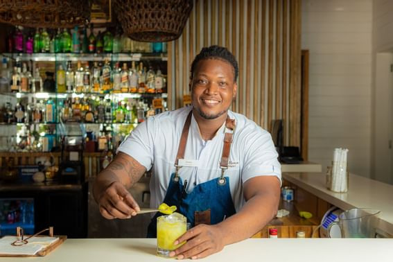 Bartender preparing a cocktail at Ibagari Boutique Hotel