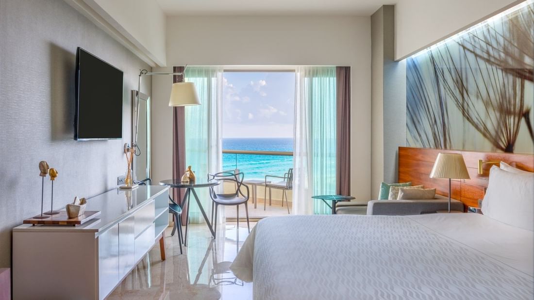 Premium Ocean View with king bed and sitting area faced TV at Live Aqua Beach Resort Cancun