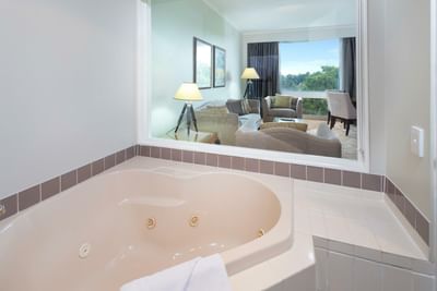 Bathroom with a bathtub in a room at Royal on the Park hotel