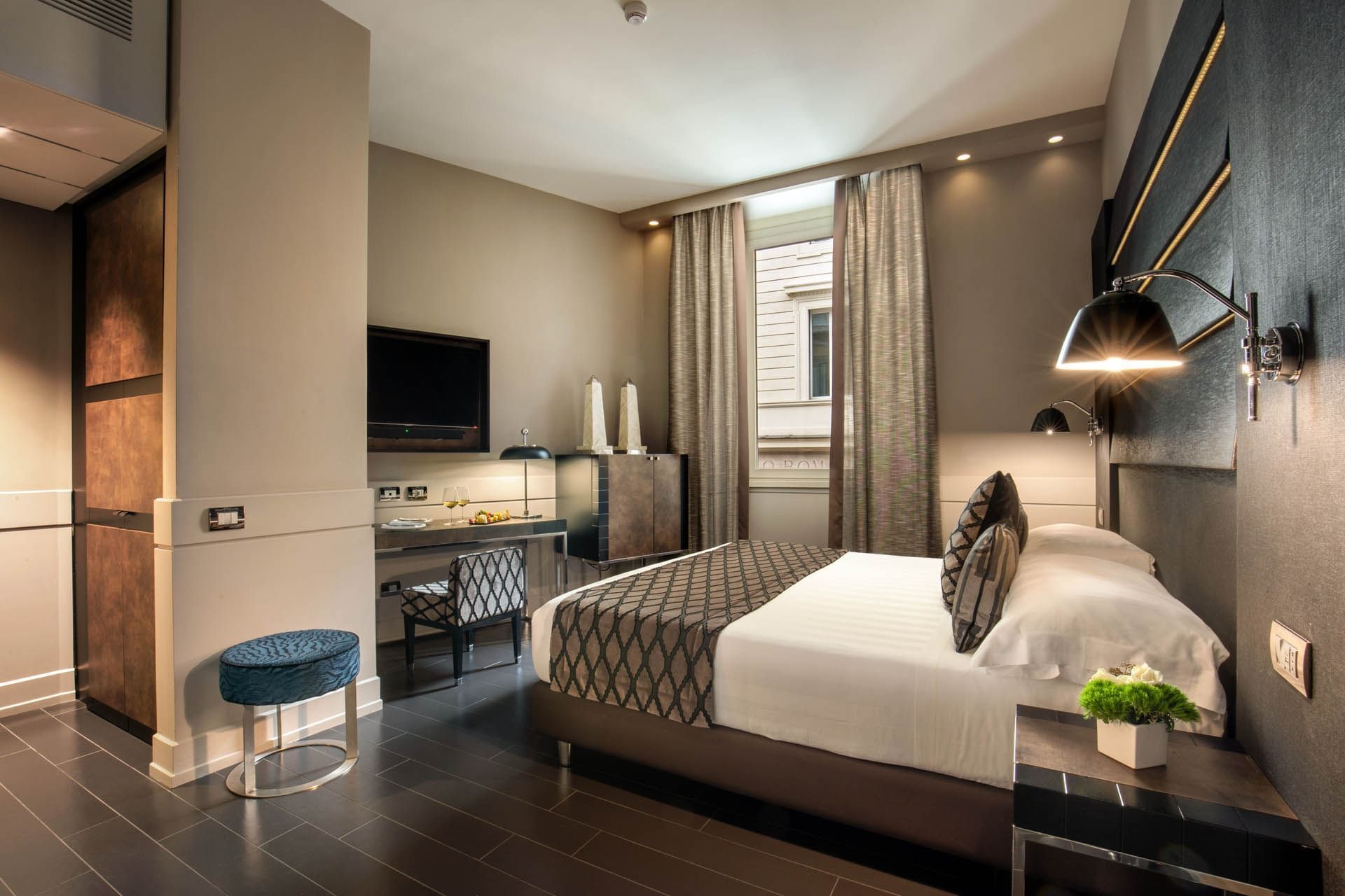 Interior of Superior Room with handcrafted furniture and warm lighting at The Style