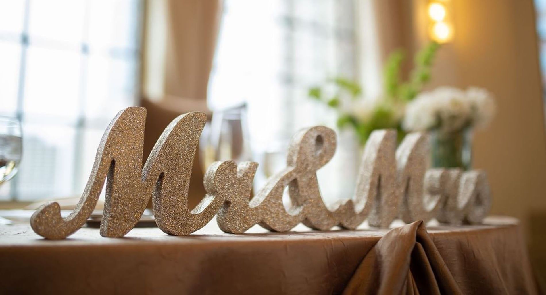 Close-up of glittery Mr and Mrs letters on a table at Warwick Allerton Chicago