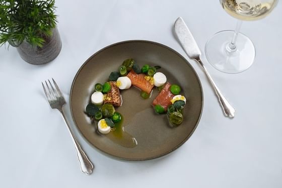 A steak meal served on a table at Imlauer Schloss Hotel