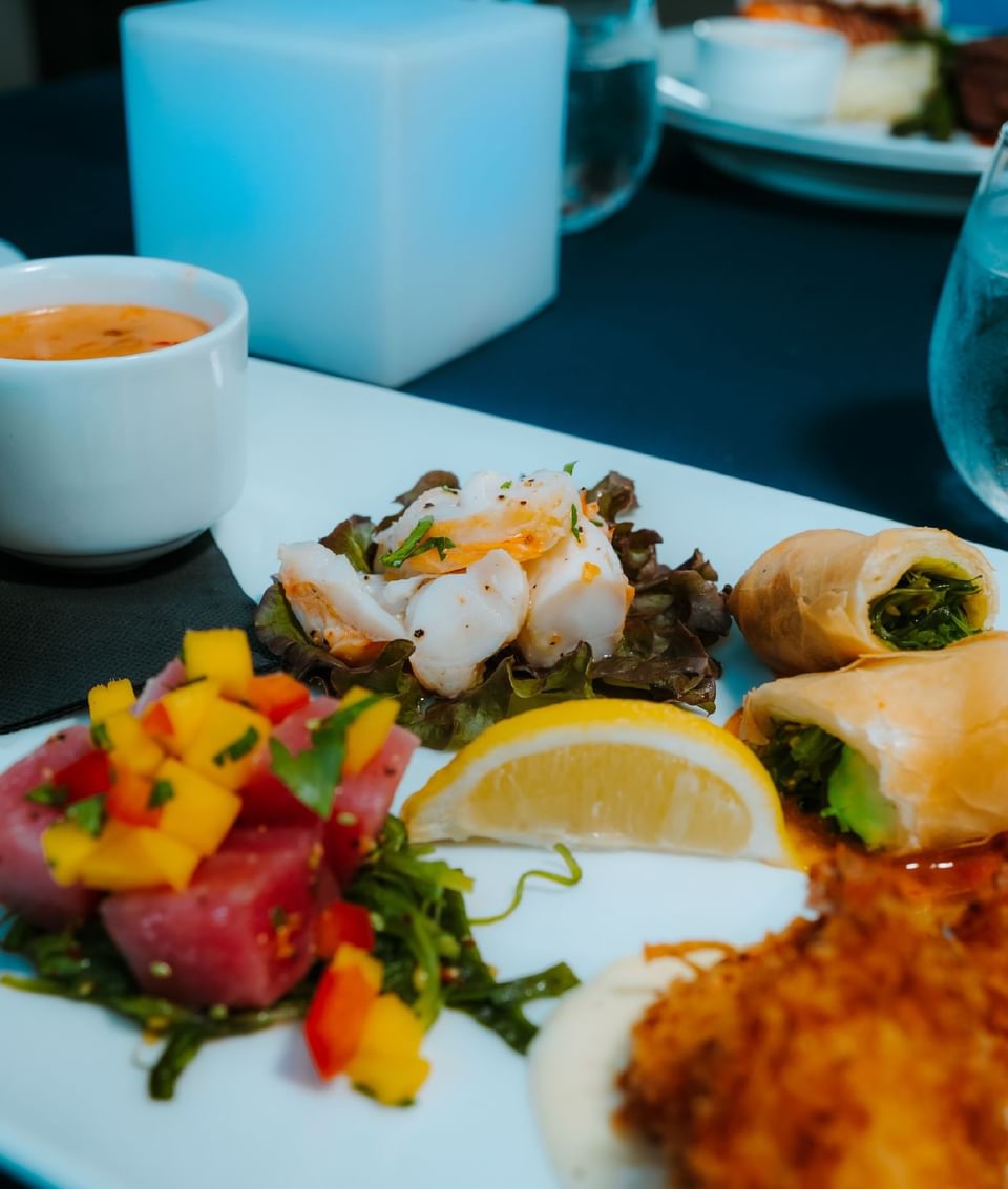 Variety of food with gravy served on a plate at Passions on the Beach