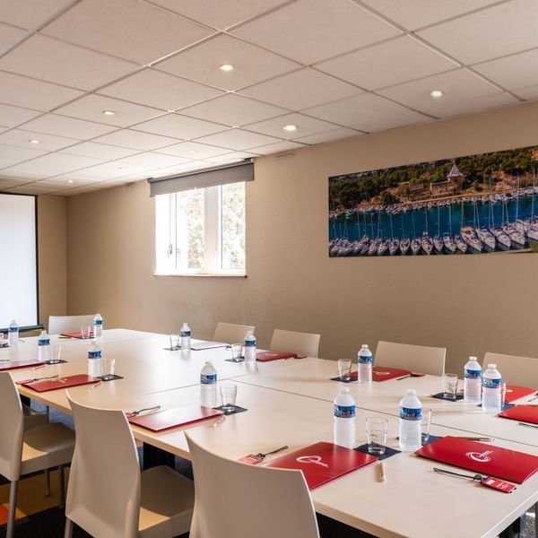 Table arrangement in a meeting room at The Originals Hotels