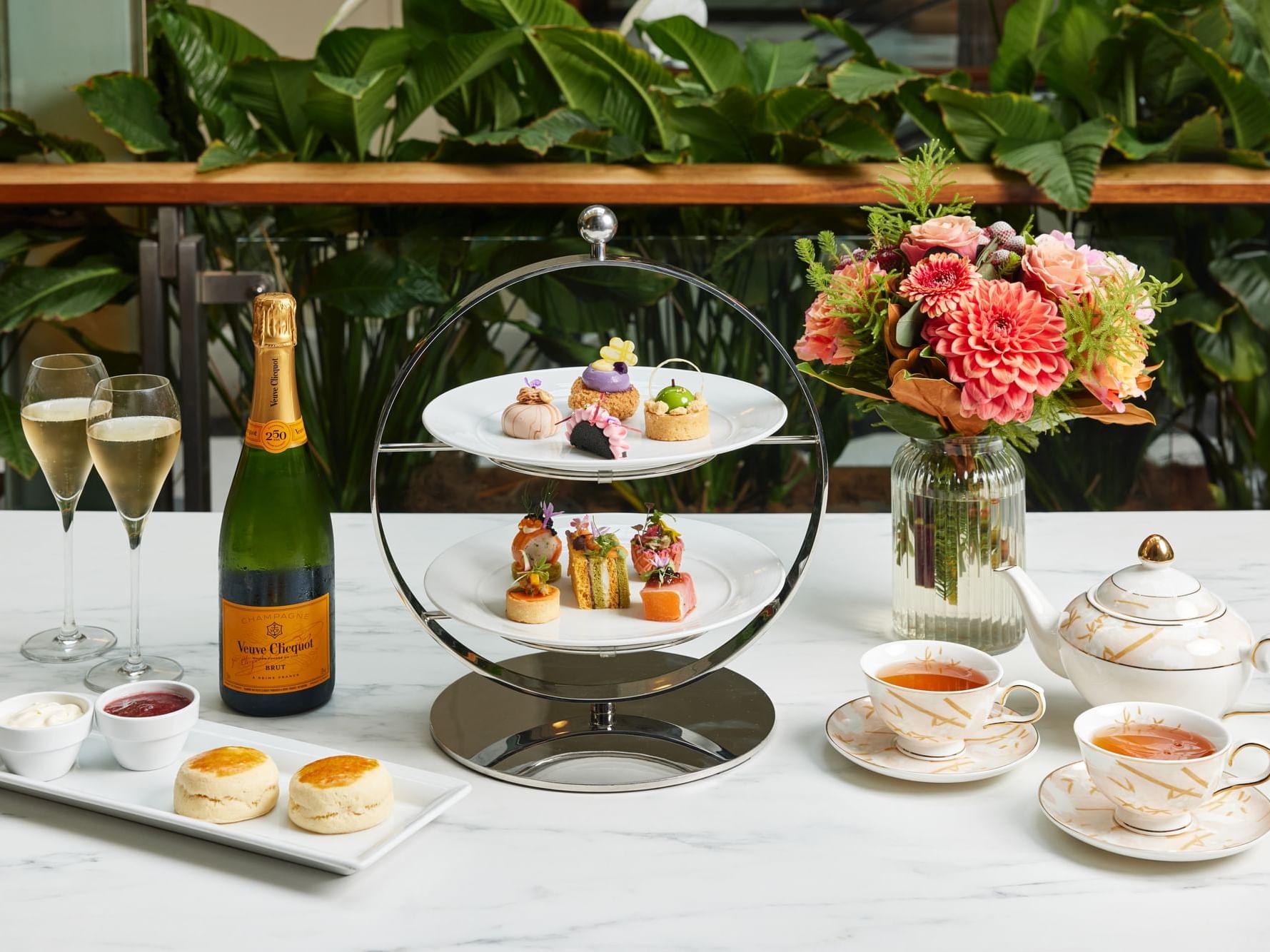 Outdoor high tea set-up with sweets and champagne served at Fullerton Group