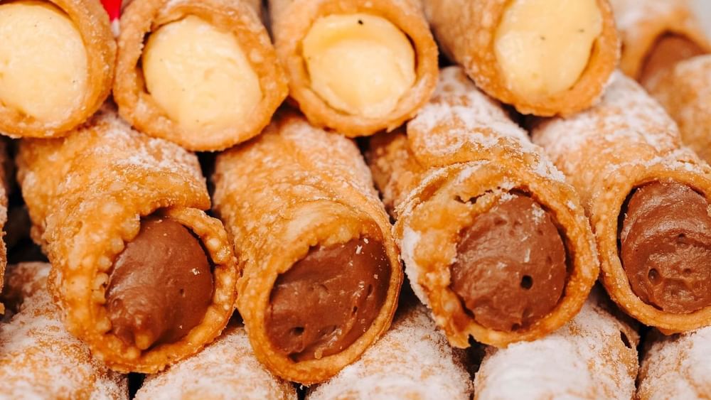 Crispy pastry rolls filled with creamy vanilla and chocolate fillings served in Marine Room at Novotel Sydney Olympic Park