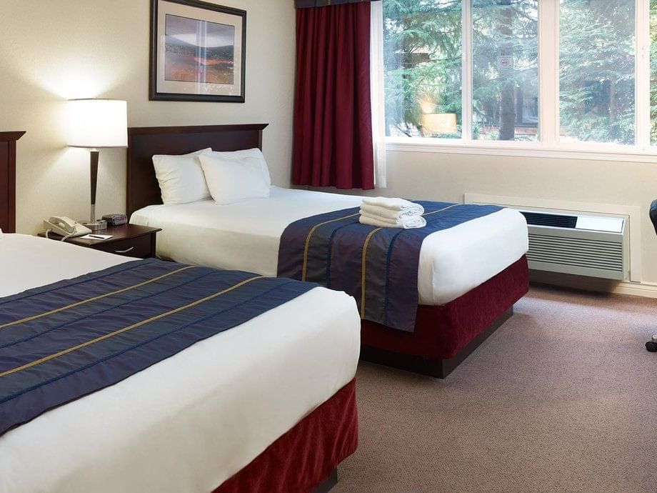 West Wing: Lake View Two Queens with cozy beds at Harrison Hot Springs Resort