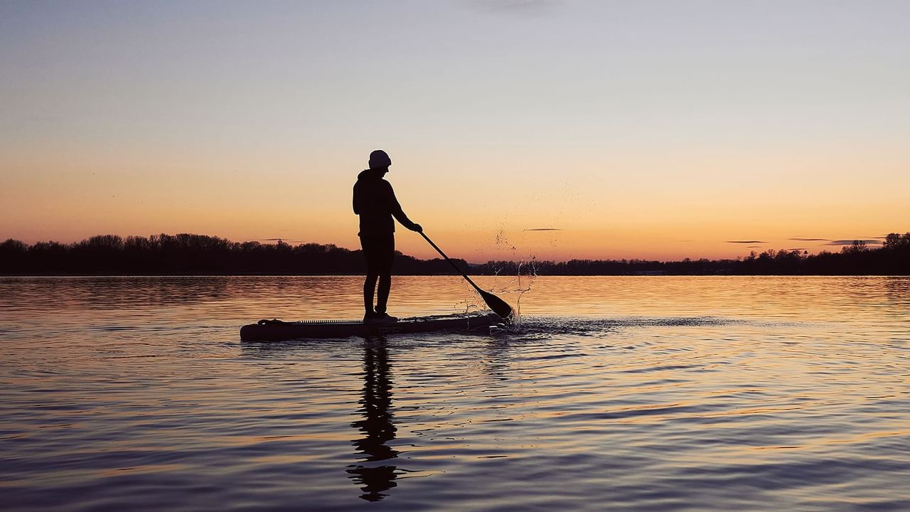  Paddle boarding during sunset near The Oceanside Hotel