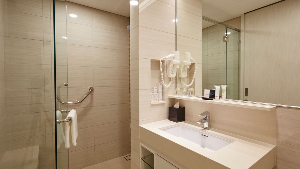 Modern bathroom with shower, sink, and mirror at Sunway Velocity Hotel in Kuala Lumpur.