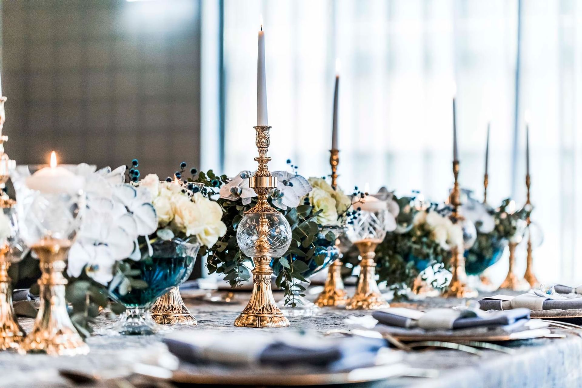 Floral table decor with candles & cutlery at Amora Hotel Sydney