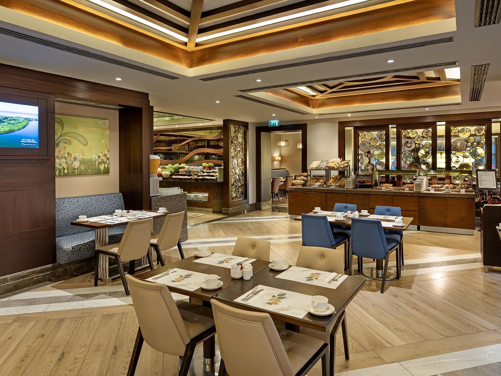 Alesta Restaurant with dining tables, chairs, and the buffet at Titanic City Taksim.