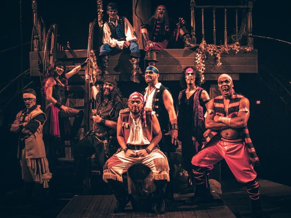 People dressed like pirates posing at Pirates Dinner Adventure near Lake Buena Vista Resort Village & Spa