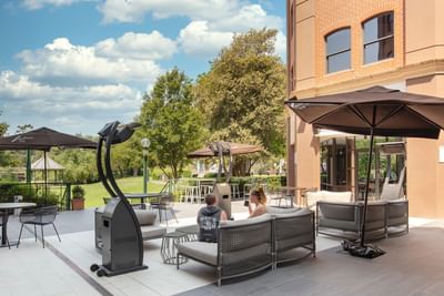 Couple in the open lounge area at Amora Hotel Melbourne