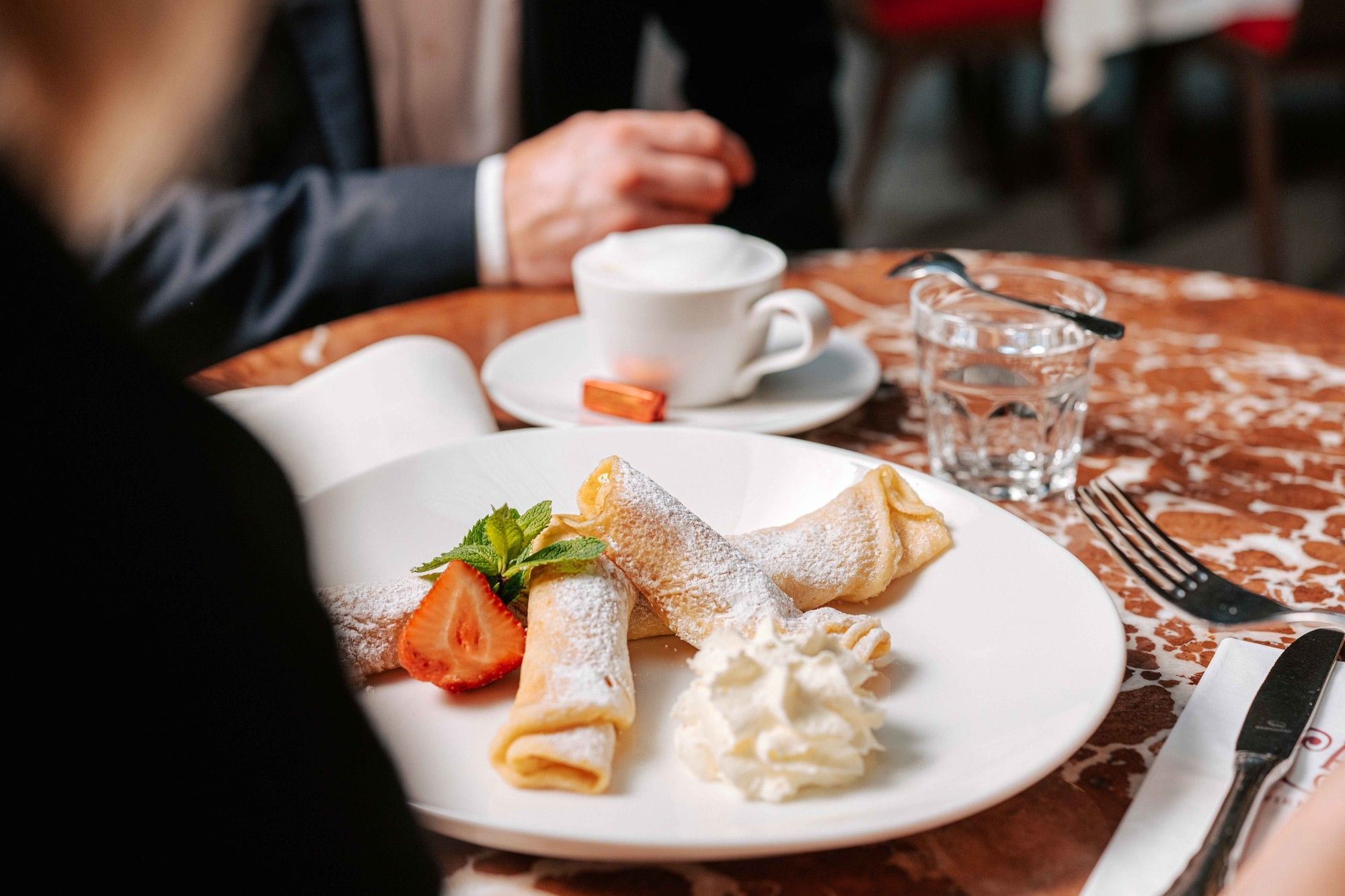 Sweet Viennese dessert at Café Central in Vienna with coffee, whipped cream and classic coffee house atmosphere