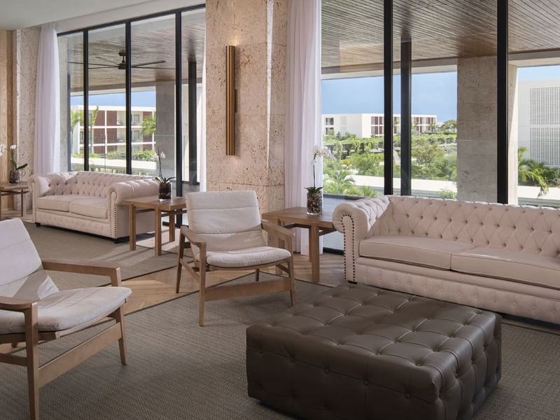 Lounge area arranged with cozy sofa at Live Aqua Punta Cana