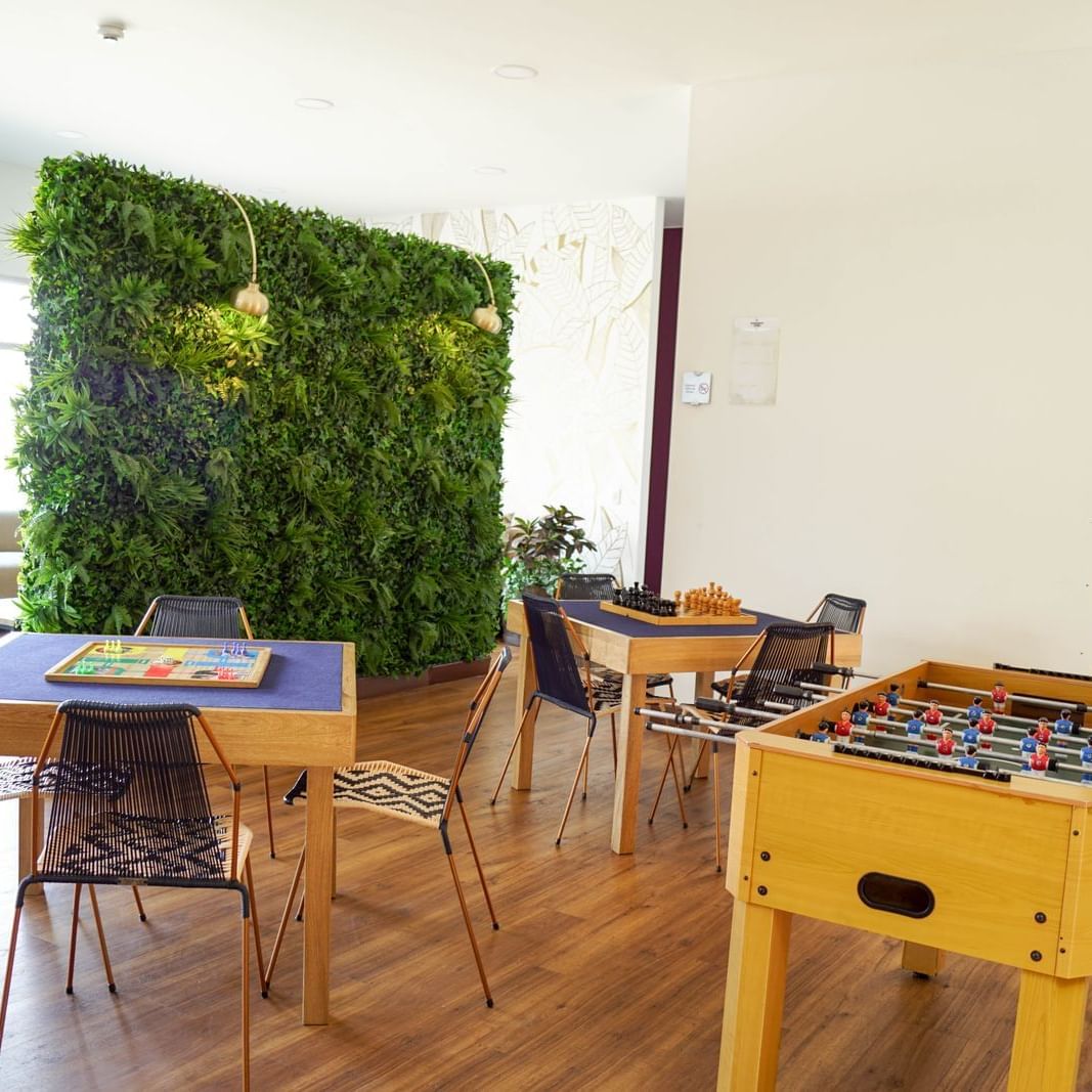 Interior of gaming room with a foosball table at Factory Green