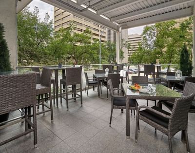 Outdoor dining on a terrace in a restaurant at Matrix Hotel