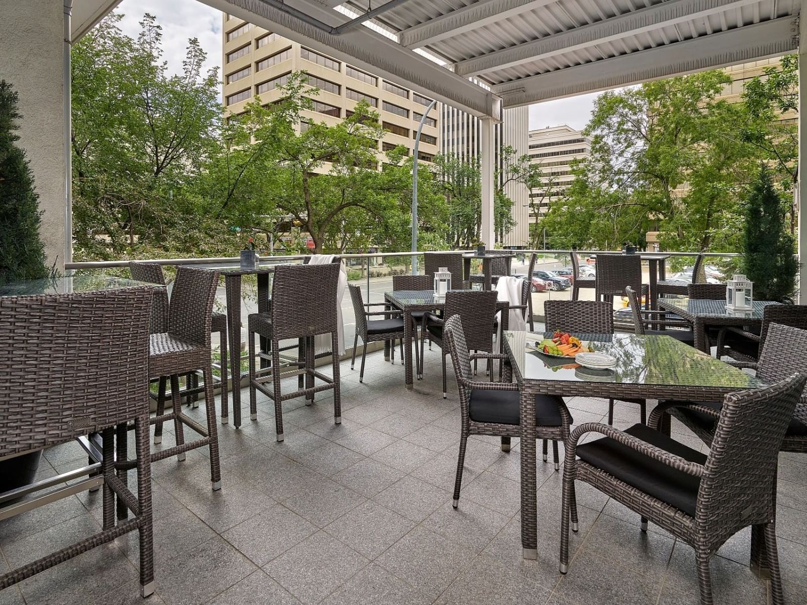 Outdoor dining on a terrace in a restaurant at Matrix Hotel