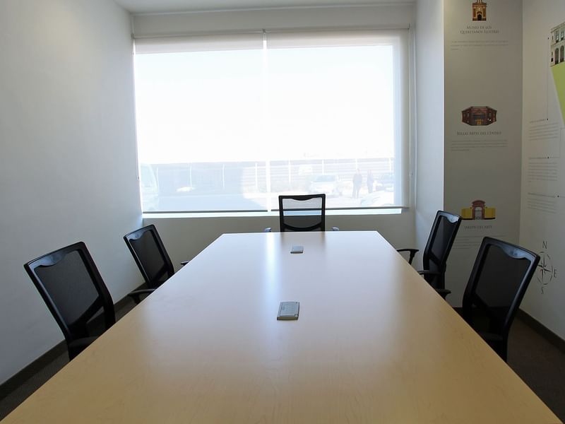 Conference table with chairs in a Meeting Room at One Hotels