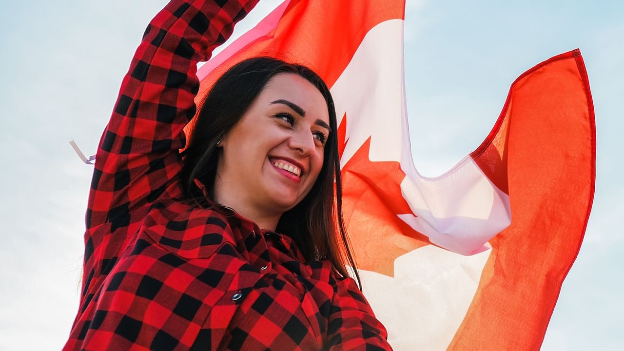 woman holding a Canadian flag